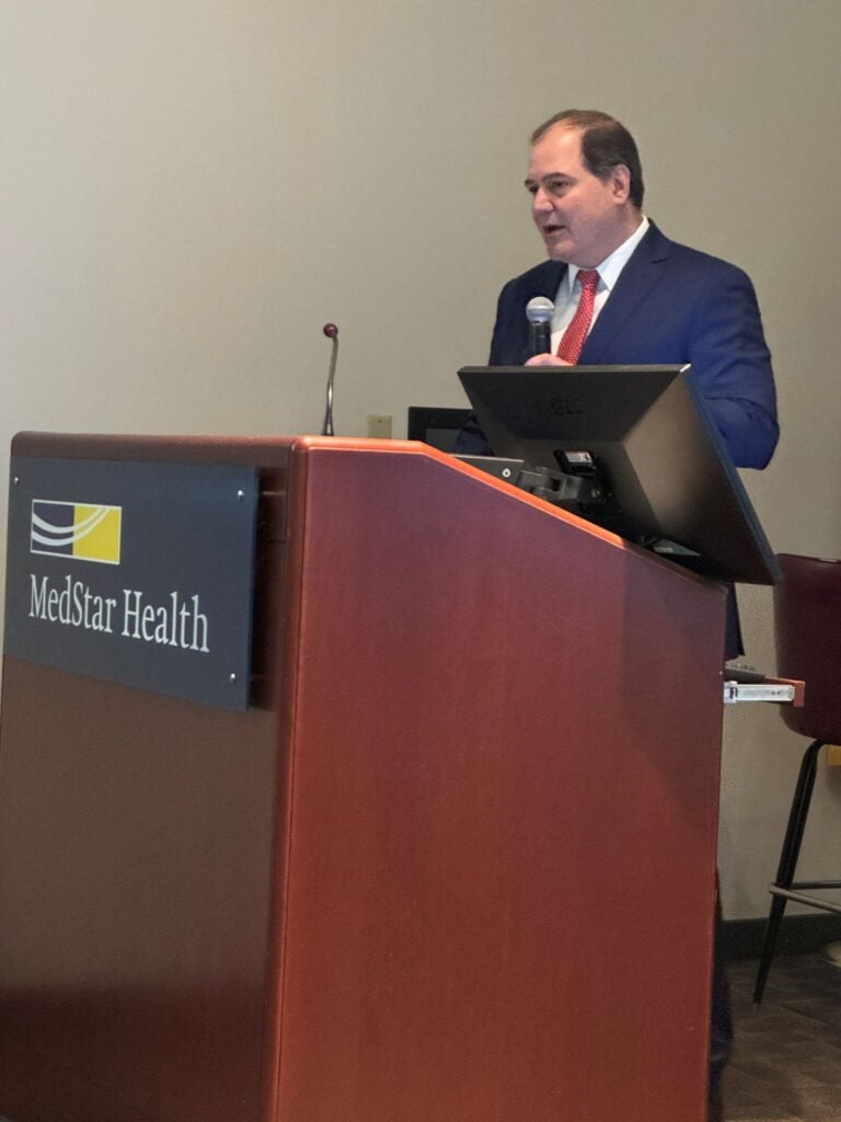 John Rockwood speaking at the podium